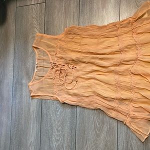 Flareat tank top. Sz med. lined with adjustable straps. Peach color